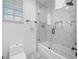 Clean bathroom with a shower/tub combo, marble tile and updated fixtures at 3031 W Asbury Pl, Tampa, FL 33611