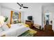 Cozy bedroom with a queen-size bed, and a view of the backyard at 3031 W Asbury Pl, Tampa, FL 33611
