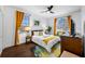 Bright bedroom with queen-size bed, window, and dresser at 3031 W Asbury Pl, Tampa, FL 33611