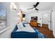 Bedroom with a daybed, TV, and plenty of natural light at 3031 W Asbury Pl, Tampa, FL 33611