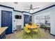 Bright dining area with a round table, four chairs, and a wood floor at 3031 W Asbury Pl, Tampa, FL 33611