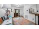 Bright entryway with rug, console table, and mirror at 3031 W Asbury Pl, Tampa, FL 33611