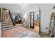 Welcoming entryway with stairs, wood floors, and view into dining area at 3031 W Asbury Pl, Tampa, FL 33611