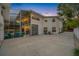 Two-story house with screened porch and circular driveway at night at 3031 W Asbury Pl, Tampa, FL 33611