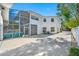 Two-story house with screened porch and circular driveway at 3031 W Asbury Pl, Tampa, FL 33611