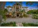 Two-story house with a circular driveway and lush landscaping at 3031 W Asbury Pl, Tampa, FL 33611