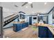 Spacious kitchen with blue cabinets, granite counters, and stainless steel appliances at 3031 W Asbury Pl, Tampa, FL 33611