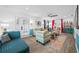 Living room with teal accents, comfy seating, and colorful rug at 3031 W Asbury Pl, Tampa, FL 33611