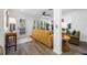 Living area with yellow couch and access to patio at 3031 W Asbury Pl, Tampa, FL 33611