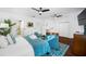 Main bedroom with king-size bed, ensuite bathroom access, and sitting area at 3031 W Asbury Pl, Tampa, FL 33611
