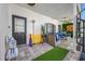 Covered patio featuring a Connect Four game and additional seating at 3031 W Asbury Pl, Tampa, FL 33611