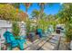 Charming patio with seating area and grilling station at 3031 W Asbury Pl, Tampa, FL 33611