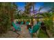 Backyard patio with fire pit, grill and seating at 3031 W Asbury Pl, Tampa, FL 33611