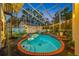 Inviting pool with brick decking, spiral staircase, and lush landscaping at 3031 W Asbury Pl, Tampa, FL 33611