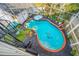 Inviting kidney-shaped pool with a spa and lush landscaping at 3031 W Asbury Pl, Tampa, FL 33611