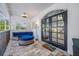 Relaxing screened porch with outdoor seating and access to the backyard at 3031 W Asbury Pl, Tampa, FL 33611