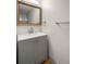 Updated bathroom with gray vanity and a large mirror at 3100 Hartford N St # 224, St Petersburg, FL 33713