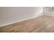 Simple bedroom with light walls and wood-look floors at 3100 Hartford N St # 224, St Petersburg, FL 33713