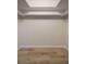 Large walk-in closet with light wood flooring and shelving at 3100 Hartford N St # 224, St Petersburg, FL 33713