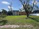 Exterior of a two-story home with lawn and mature tree at 3418 2Nd S Ave, St Petersburg, FL 33711