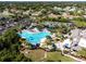 Expansive community pool with surrounding lounge and patio areas at 402 Dorchester Pl # 28, Sun City Center, FL 33573