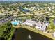 Large community pool, clubhouse, and surrounding neighborhood at 402 Dorchester Pl # 28, Sun City Center, FL 33573