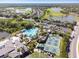 Aerial view showing resort-style pool and pickleball courts at 402 Dorchester Pl # 28, Sun City Center, FL 33573