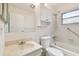 Bathroom with tub, toilet and vanity at 402 Dorchester Pl # 28, Sun City Center, FL 33573