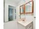Bathroom with sink and mirrored medicine cabinet at 402 Dorchester Pl # 28, Sun City Center, FL 33573
