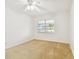 Bedroom with window, ceiling fan and carpet at 402 Dorchester Pl # 28, Sun City Center, FL 33573