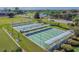 Aerial view of community bocce ball courts with covered seating areas at 402 Dorchester Pl # 28, Sun City Center, FL 33573