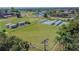 Aerial view of community bocce ball courts with covered seating areas at 402 Dorchester Pl # 28, Sun City Center, FL 33573