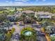 Community clubhouse with fountain and palm trees at 402 Dorchester Pl # 28, Sun City Center, FL 33573