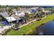 Community clubhouse near a pond with patio seating at 402 Dorchester Pl # 28, Sun City Center, FL 33573
