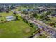 Aerial view of community entrance and surrounding landscape at 402 Dorchester Pl # 28, Sun City Center, FL 33573