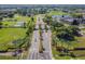 Aerial view of community entrance with landscaped medians at 402 Dorchester Pl # 28, Sun City Center, FL 33573