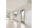 Light and airy entryway with tile floors and mirror at 402 Dorchester Pl # 28, Sun City Center, FL 33573