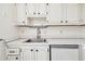Stainless steel sink with white cabinets and countertops at 402 Dorchester Pl # 28, Sun City Center, FL 33573