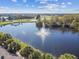 Serene lake view with a water fountain feature at 402 Dorchester Pl # 28, Sun City Center, FL 33573