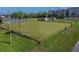 Spacious lawn bowling green surrounded by landscaping at 402 Dorchester Pl # 28, Sun City Center, FL 33573