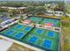 Eight well-maintained pickleball courts with covered seating at 402 Dorchester Pl # 28, Sun City Center, FL 33573