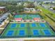 Eight well-maintained pickleball courts with covered seating at 402 Dorchester Pl # 28, Sun City Center, FL 33573