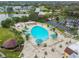 Resort-style pool with ample lounge chairs and umbrellas at 402 Dorchester Pl # 28, Sun City Center, FL 33573