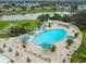 Resort-style pool with ample lounge chairs and umbrellas at 402 Dorchester Pl # 28, Sun City Center, FL 33573