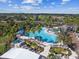 Large freeform pool with plenty of lounge chairs at 402 Dorchester Pl # 28, Sun City Center, FL 33573