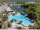 Large community pool with surrounding lounge chairs at 402 Dorchester Pl # 28, Sun City Center, FL 33573