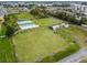Aerial view of community shuffleboard courts with covered seating at 402 Dorchester Pl # 28, Sun City Center, FL 33573