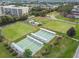 Aerial view of community shuffleboard courts with covered seating areas at 402 Dorchester Pl # 28, Sun City Center, FL 33573