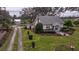 House with a long driveway and landscaping at 4156 Mcintosh Rd, Dover, FL 33527