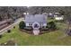 Charming house with landscaped yard and driveway, seen from above at 4156 Mcintosh Rd, Dover, FL 33527
